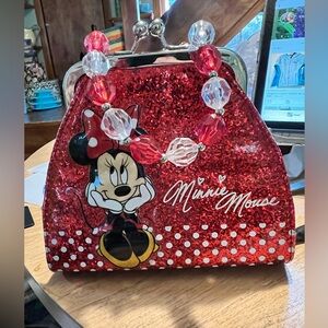 Children’s vinyl red and white polka dot Minnie Mouse purse with metal clasp.